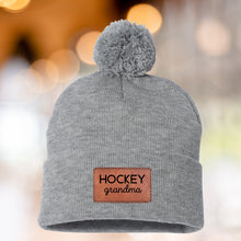 Load image into Gallery viewer, Hockey Grandma Beanie Winter Hat Leather Patch Grandma Gift Hockey Fan Winter Wear Warm Beanie Pom Top Cold Weather Rink Accessory Team Mom