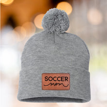 Load image into Gallery viewer, Soccer Mom Beanie Winter Hat Leather Patch Mom Gift Soccer Fan Winter Wear Warm Beanie Pom Top Cold Weather Field Accessory Team Mom Sport