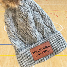 Load image into Gallery viewer, Volleyball Mom Beanie Winter Hat Leather Patch Mom Gift Volleyball Fan Winter Wear Warm Beanie Pom Top Cold Weather Court Accessory Team Mom