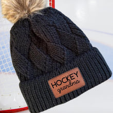Load image into Gallery viewer, Hockey Grandma Beanie Winter Hat Leather Patch Grandma Gift Hockey Fan Winter Wear Warm Beanie Pom Top Cold Weather Rink Accessory Team Mom